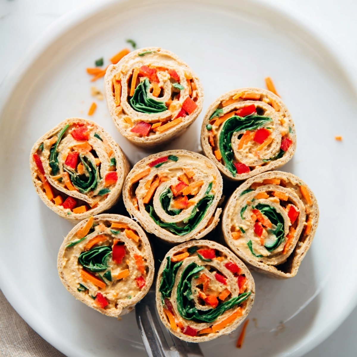 Creamy Veggie Hummus Pinwheels: Swirls of flavor, making these an irresistible, healthy snack.