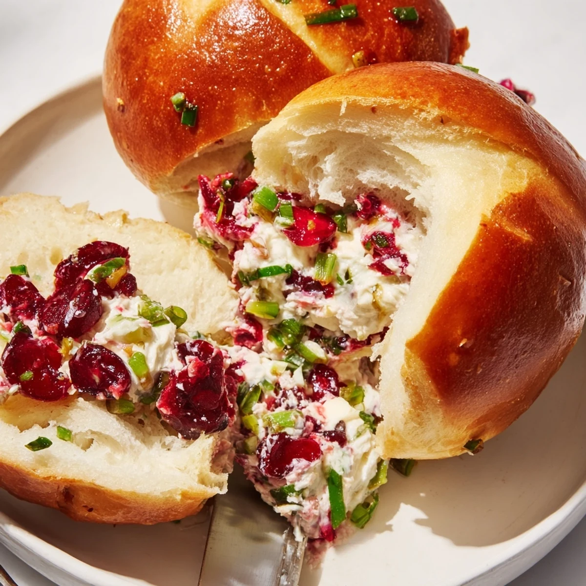 Creamy cranberry jalapeño dip rolls, warm and inviting, perfect for festive gatherings.  