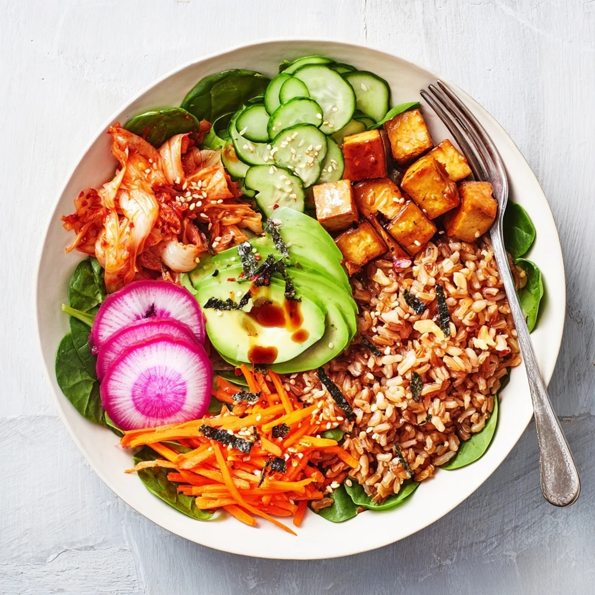 Vibrant fermented vegetable bowl showcasing kimchi, crunchy radishes, and hearty grains.  