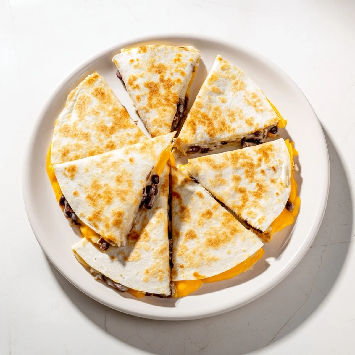 Golden, crispy bean and cheese quesadillas, oozing melted cheese, and ready for a quick Mexican meal.
