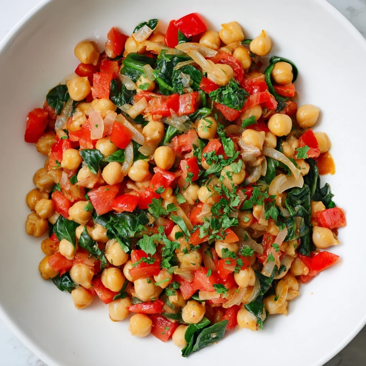 Steaming hot Vegetarian Chickpea & Spinach Skillet, showcasing vibrant colors and enticing aromas.