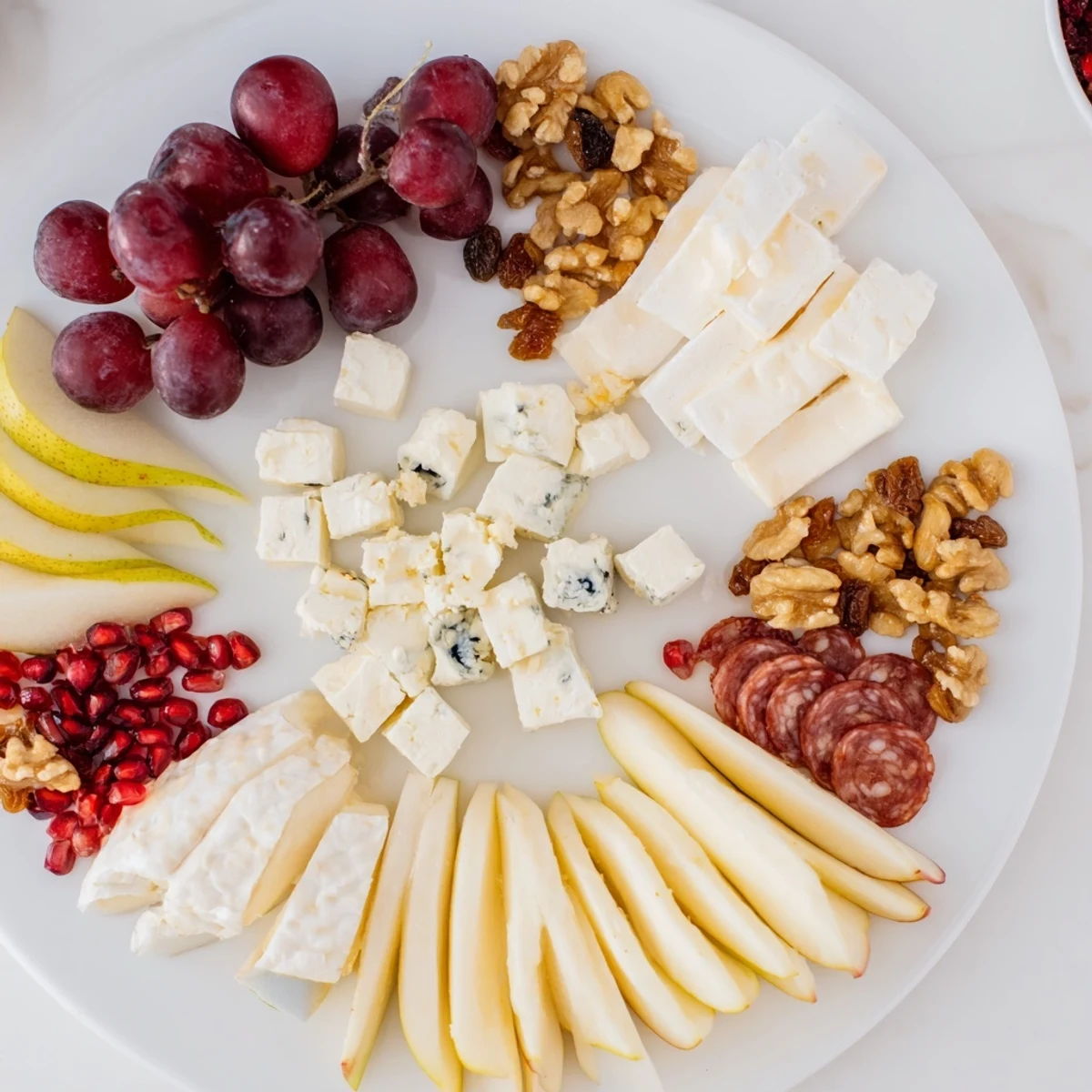 Imagine a festive Moments Magiques Plateau Bonne Année 2026, piled high with Brie, grapes, and flavorful meats—perfect for midnight!