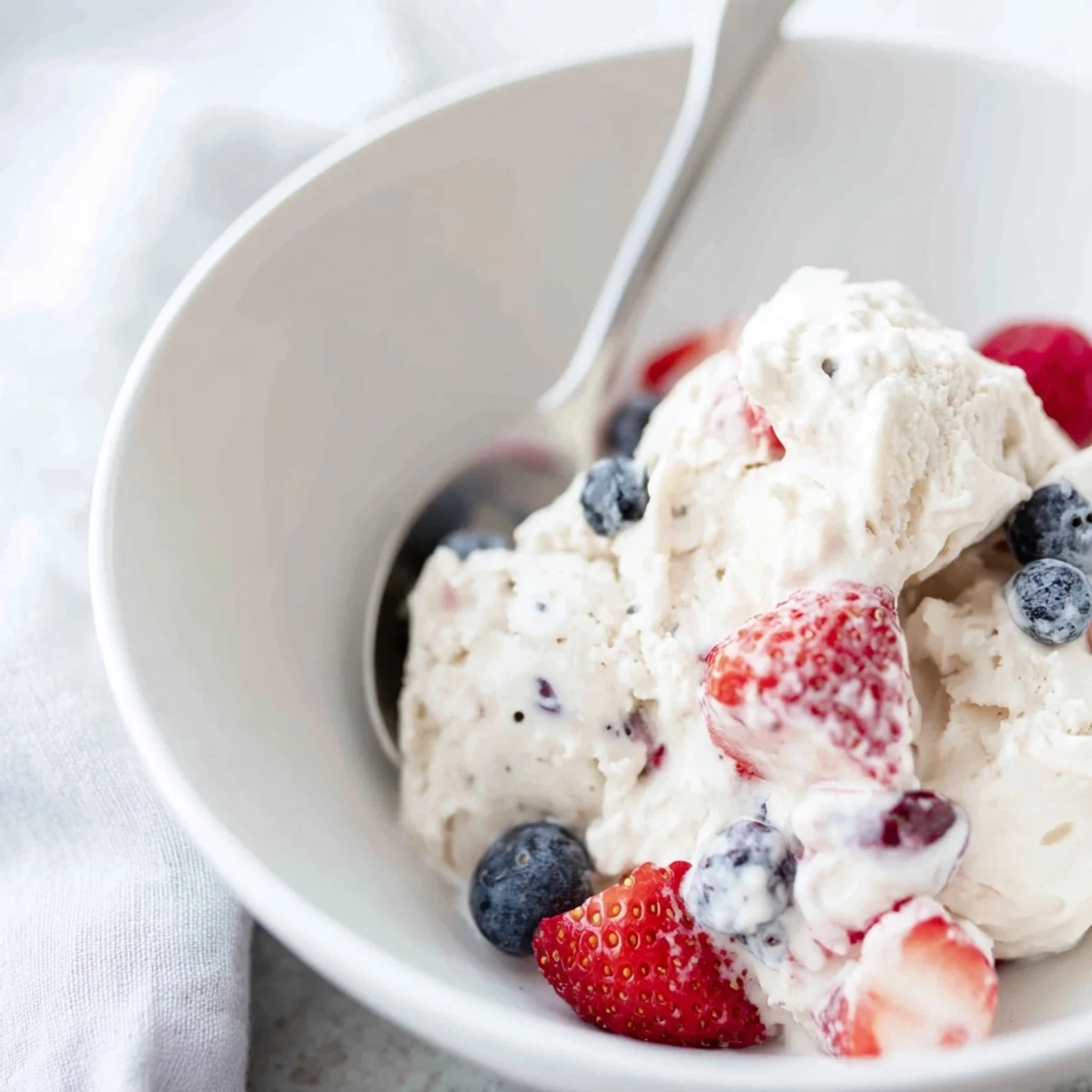 Freshly blended cottage cheese ice cream, a vibrant pink color, perfect for a summertime dessert.