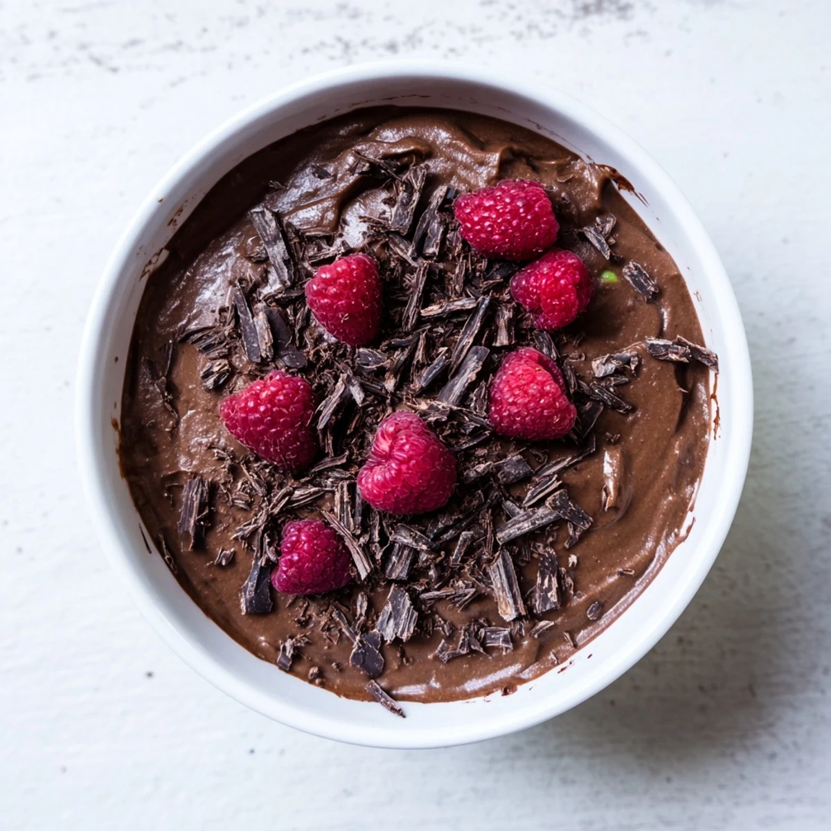 A close-up shot of rich and creamy Chocolate Avocado Mousse, ready to be enjoyed.