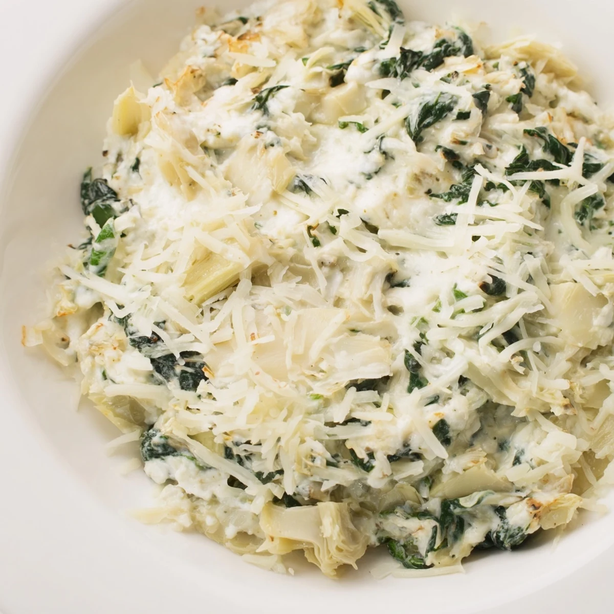 Warm, bubbly spinach artichoke dip, served with crispy tortilla chips for dipping and enjoyment.