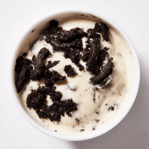 Creamy Vanilla Pudding with crushed Oreos, a layered dessert with a rich vanilla flavor and crunchy cookies.