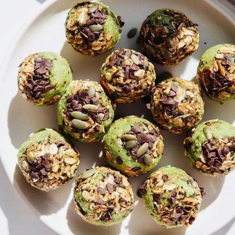 Delicious energy balls featuring earthy matcha and sweet pumpkin spice flavors, ideal for meal prep.  