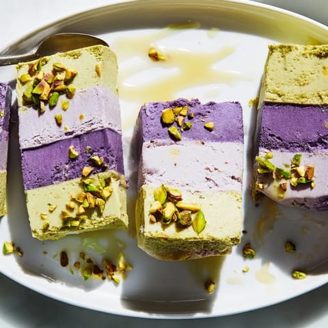 Delightfully layered ube and pistachio ice cream bars, perfect for hot days.  