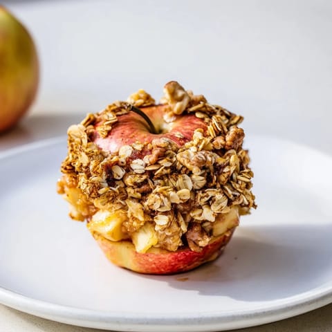 Delectable close-up of Baked Apples with Oat-Nut Crumble, showing the tender apple and crispy topping.