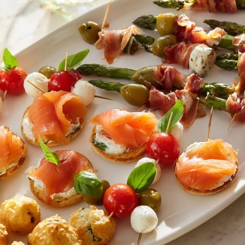 Visually appealing Magical Moments Happy New Year 2026 Platter, showcasing savory bites and delicious desserts.