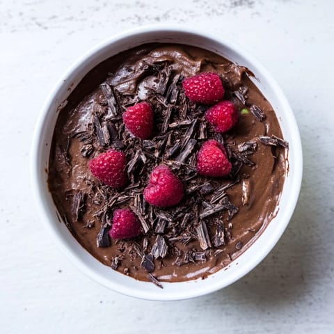 A close-up shot of rich and creamy Chocolate Avocado Mousse, ready to be enjoyed.
