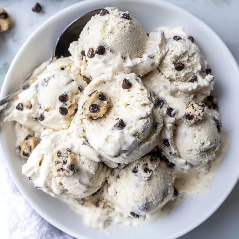 Guilt-free Cottage Cheese Ice Cream topped with rich chocolate chip cookie dough bites.  