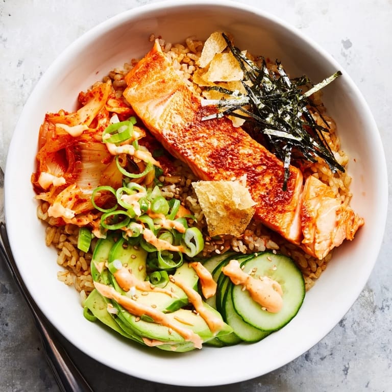 Flavorful crispy salmon served over golden, crunchy rice and tangy kimchi.  