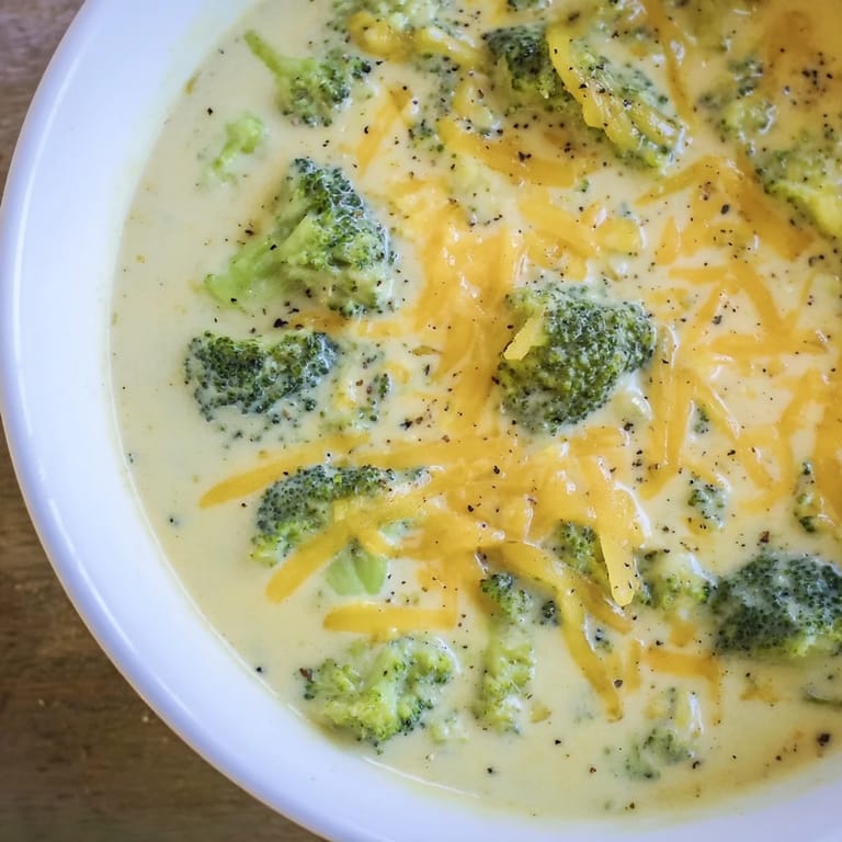A rich, creamy Broccoli Cheese Soup, a vibrant green hue, made with fresh broccoli florets.