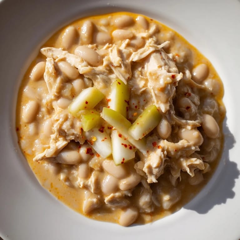 This close-up shows the hearty 35-Minute White Cheddar Apple Chicken Chili, perfect for a cozy dinner.
