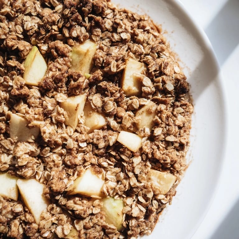 A generous dish of homemade Best Apple Crisp, showcasing soft, cinnamon-kissed apples under a crunchy crust.