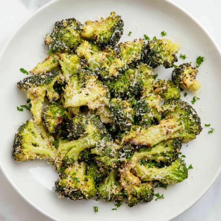 Close-up of savory Garlic Parmesan Roasted Broccoli, perfectly cooked and ready to eat.